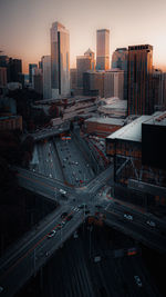 High angle view of buildings in city at sunset