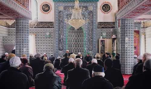 Group of people in temple outside building