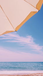 Low angle view of beach against sky during sunset