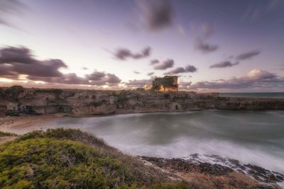 Scenic view of sea against sky at sunset