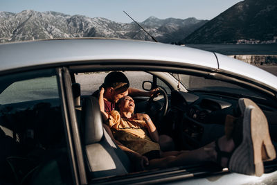 Portrait of man sitting in car