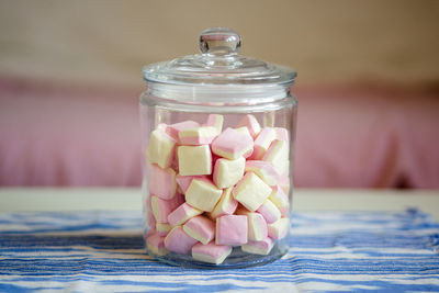 Close-up of ice cream in jar on table