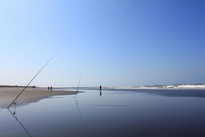 Scenic view of beach against clear sky