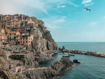Panoramic view of sea and rocks against sky