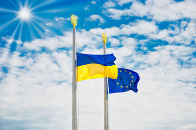 Low angle view of flag against sky