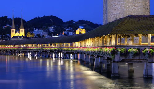 Illuminated building at waterfront