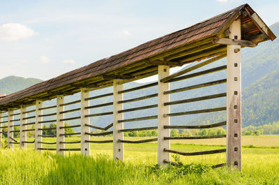 Gazebo in farm against sky