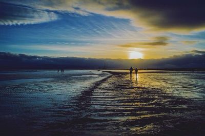 Scenic view of sea at sunset