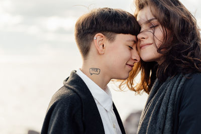 Portrait of couple kissing outdoors
