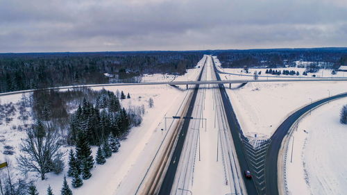 High angle view of snow covered road against sky