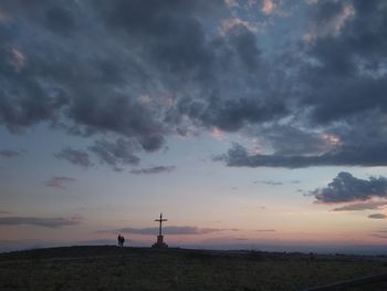 Silhouette temple against sky during sunset