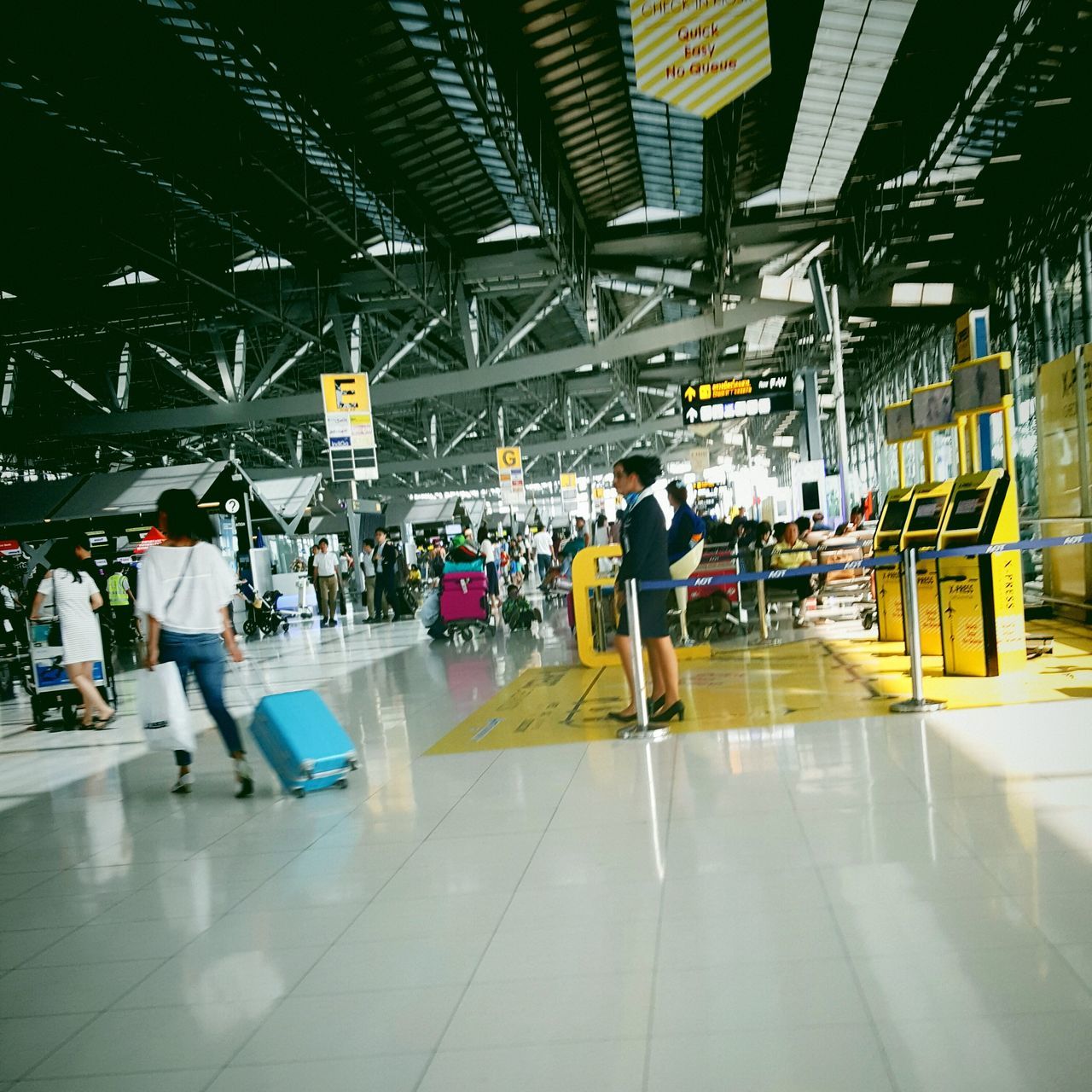 indoors, lifestyles, men, person, large group of people, leisure activity, ceiling, walking, illuminated, flooring, built structure, architecture, tiled floor, medium group of people, full length, city life, shopping mall, standing, group of people