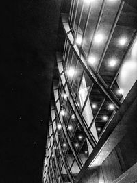 Low angle view of illuminated building at night