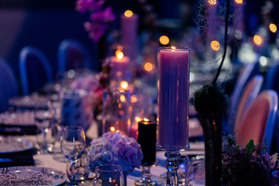 Luxury table settings for fine dining with and glassware, pouring wine to glass.