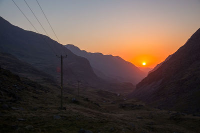 Scenic view of mountains against sky during sunset