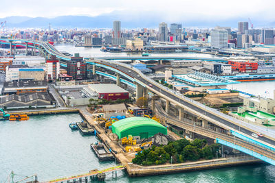 High angle view of river amidst buildings in city