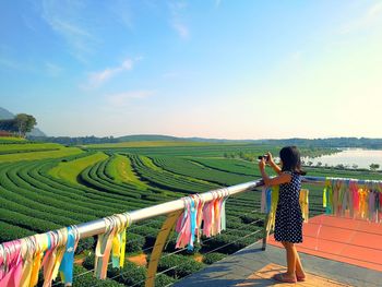 Girl taking photographs