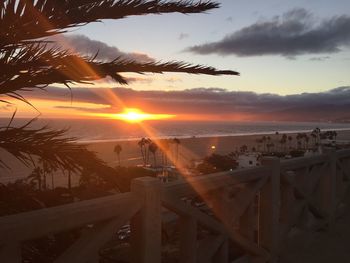 Scenic view of beach against sky during sunset