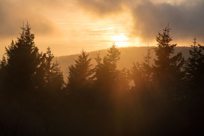 Scenic view of landscape against sky at sunset