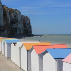 Scenic view of beach against blue sky