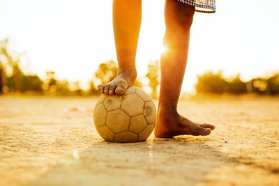 Low section of man playing with ball