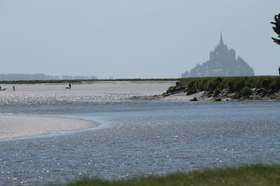 View of beach against clear sky