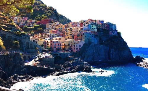 Townscape by sea against sky