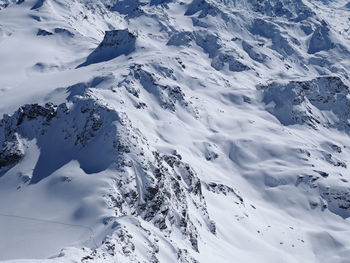 Scenic view of snow covered mountains