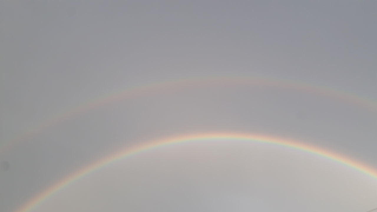 RAINBOW AGAINST SKY