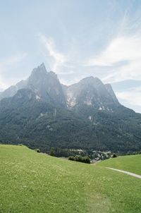 Scenic view of landscape and mountains against sky