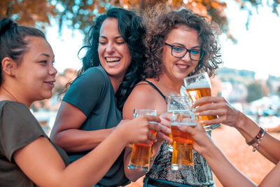 Happy women doing celebratory toast