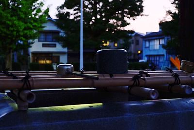 Close-up of illuminated city by street at night