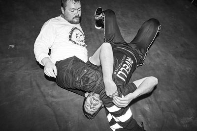 Low section of man sitting on floor