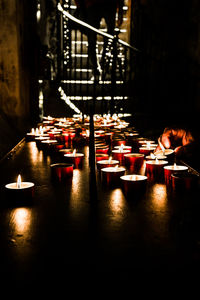 Illuminated candles in temple