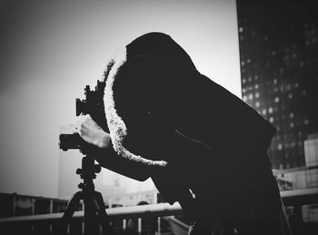 Low angle view of people in amusement park