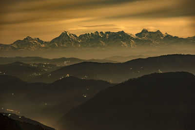 Scenic view of mountains against sky during sunset