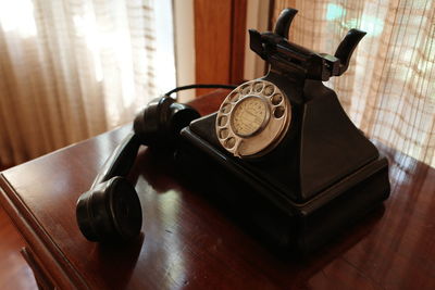 High angle view of telephone on table