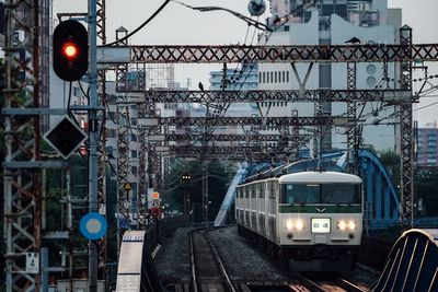 Train on railroad tracks in city