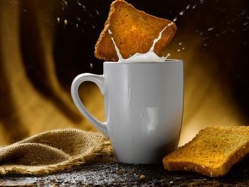 Close-up of coffee cup on table