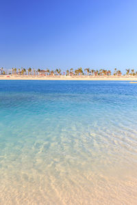 Scenic view of sea against clear blue sky