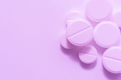 Close-up of pink over white background
