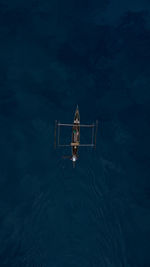 Aerial view of outrigger in sea