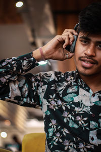 Portrait of young man looking away