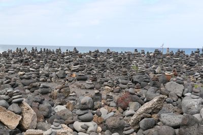 Close-up of stack of stones on seashore