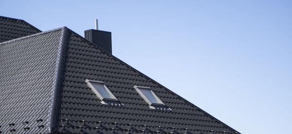 Low angle view of modern building against clear sky