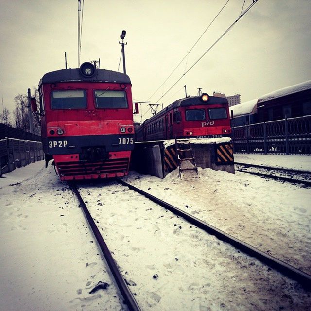 railroad track, transportation, rail transportation, public transportation, train - vehicle, mode of transport, railroad station platform, railroad station, train, sky, passenger train, land vehicle, travel, red, day, built structure, outdoors, building exterior, electricity pylon, no people