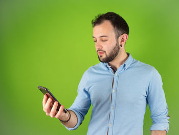 Young man using mobile phone