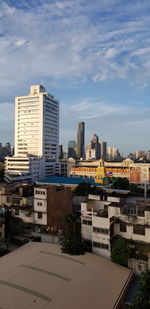 Buildings in city against sky