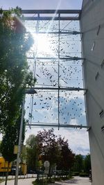 Low angle view of buildings seen through glass window