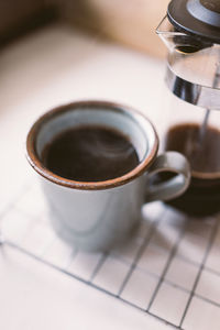 Close-up of coffee mug on table